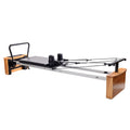Stamina Products AeroPilates Board Reformer with Oak Wood Base – Studio Grade for Home Use with Cardio Rebounder, Adjustable Foot Bar, 4 Resistance Springs, and Workout DVD
